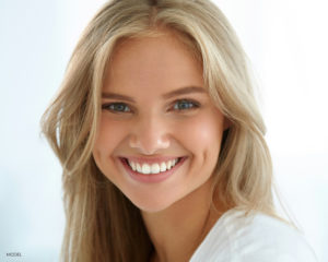 Young Blond Female Smiling At Camera